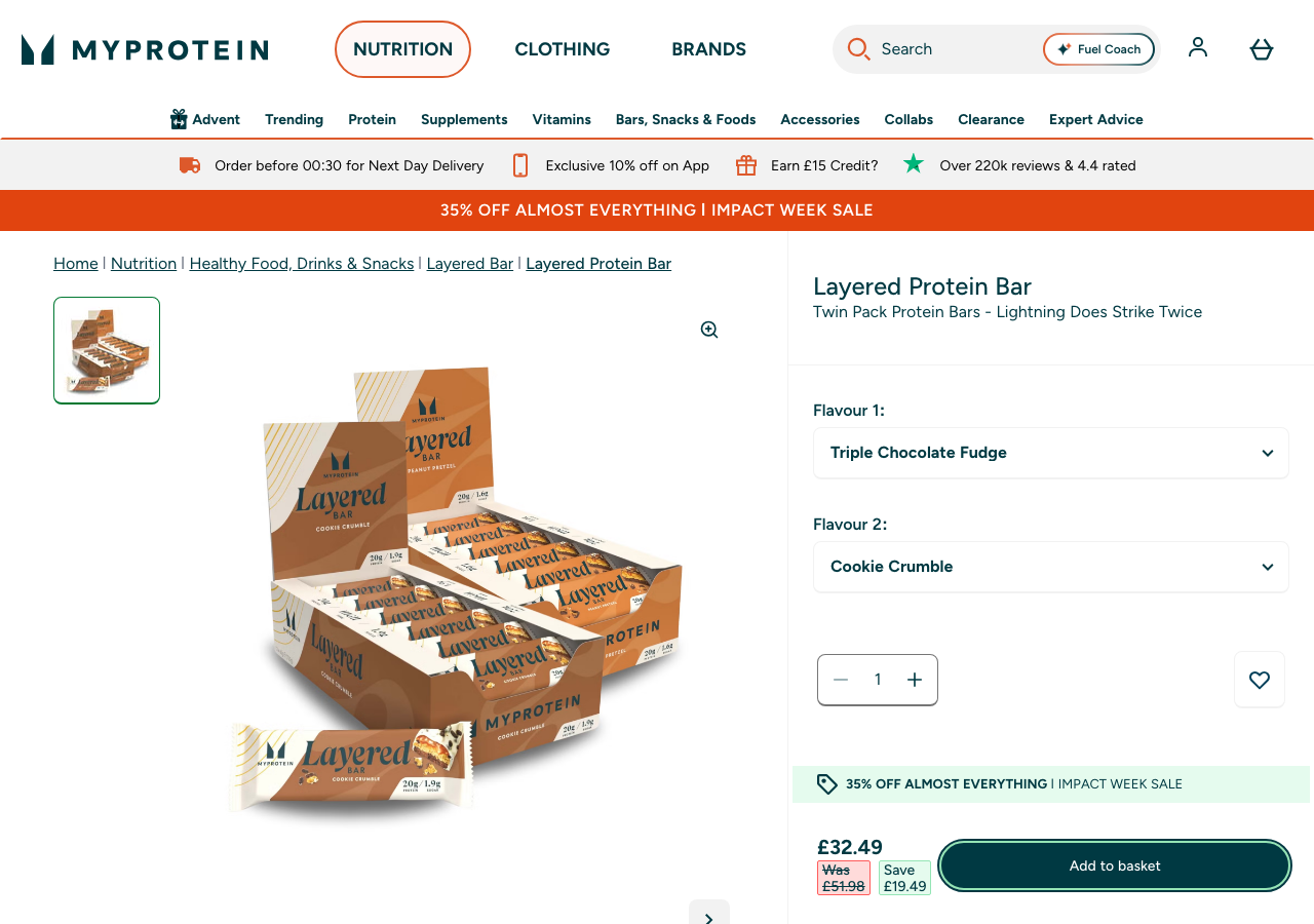 MyProtein UK product page for the Layered Protein Bar, showing a twin variety box priced at £32.49, marked down from £51.98.